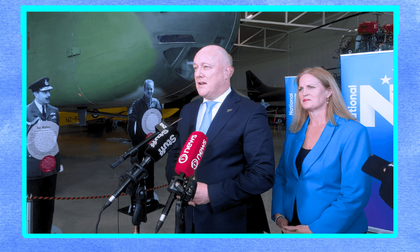 Christopher Luxon standing in front of a plane, with a national banner and Louise Upston behind him