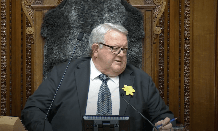 Gerry Brownlee leans over in the Speaker's seat to talk to Kieran McAnulty.