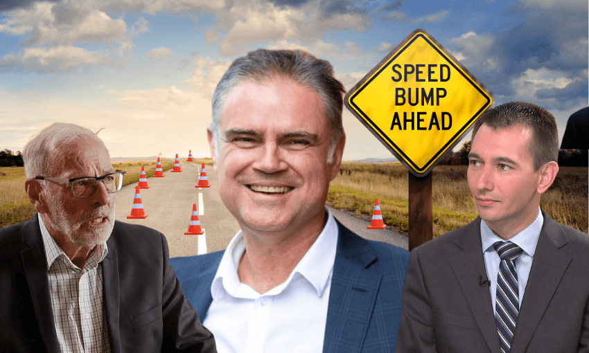 Three men in suits appear in the foreground of a rural road lined with traffic cones and a yellow "Speed Bump Ahead" sign under a cloudy sky. The man in the center is smiling, while the others appear serious.