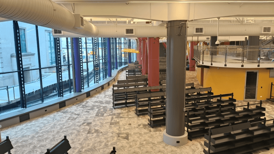 The interior of Te Matapihi, with empty bookshelves. 