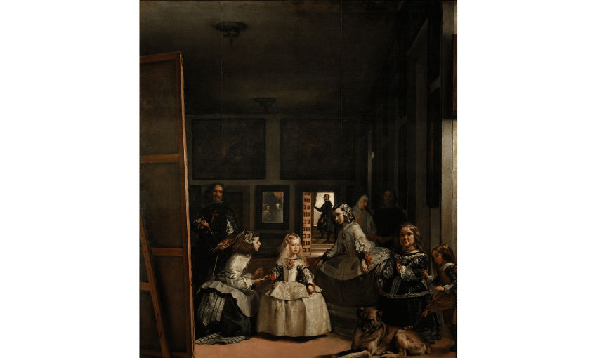 A very famous oil painting called Las Meninas by Diego Velazquez which shows a large room with paintings and royal family members in the room. 