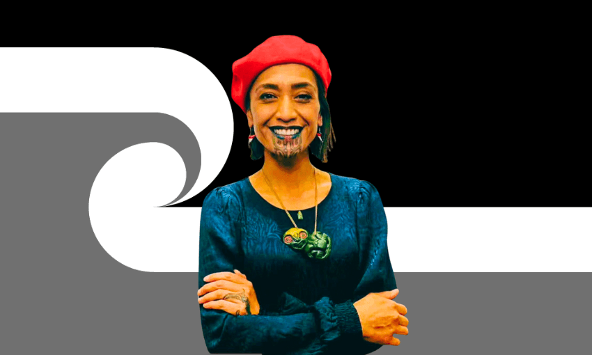A smiling person wearing a red beret, earrings, and green necklace stands with arms crossed in front of a black and white stylised koru pattern background.