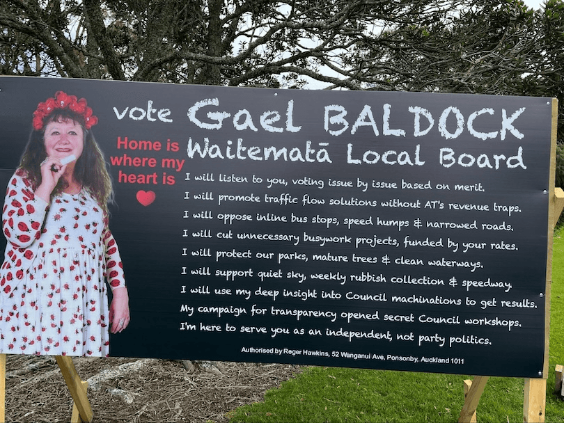 A campaign sign for Gael Baldock, Waitematā Local Board candidate, with her photo on the left. Her pledges are listed on a chalkboard background, and "Home is where my heart is" is written in red next to a heart symbol.