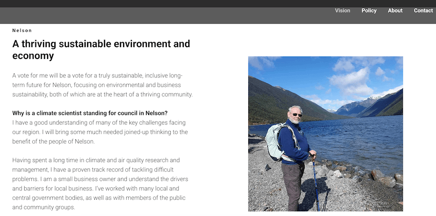 a screenshot of a website with some about text and a photo of an older man in a navy jumper wearing a backpack and holding walking poles with a lake in the background