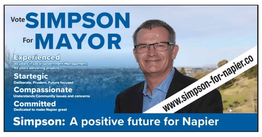 a pakeha man with the ocean behind him and the word "startegic' as well as 'simpson for mayor'