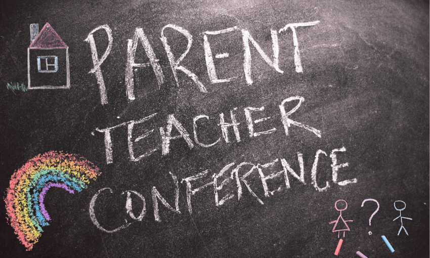 a chalkboard with "parent teacher conference" written on it and various kids drawings