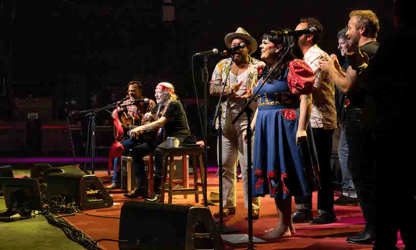 A large concert stage featuring Willie Nelson and Tami Neilson during the Outlaw tour