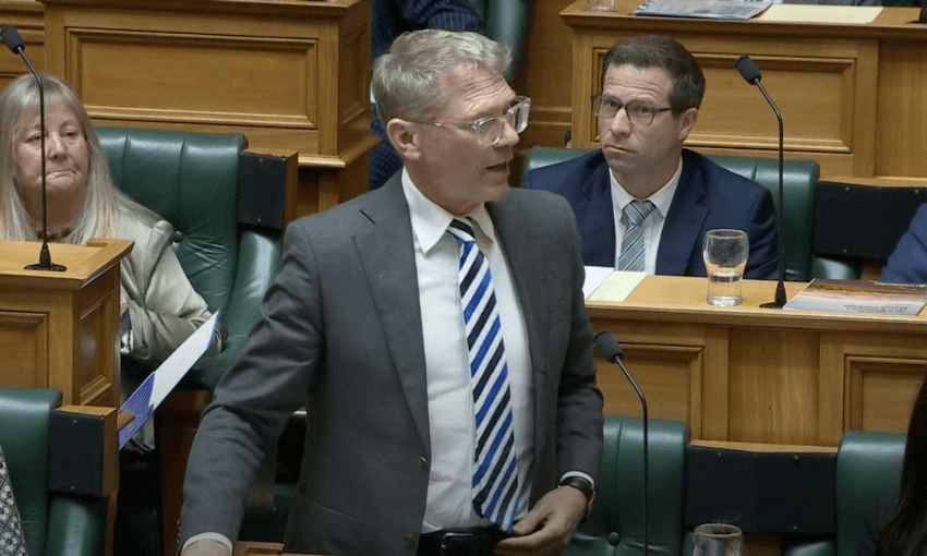 Paul Goldsmith stands behind his bench to speak in the debating chamber.