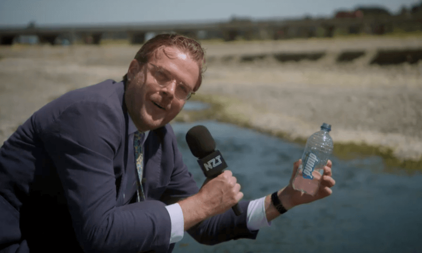Guy Williams holds some Waimate water 
