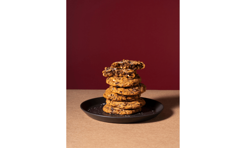A photograph of a plate piled with cookies. 