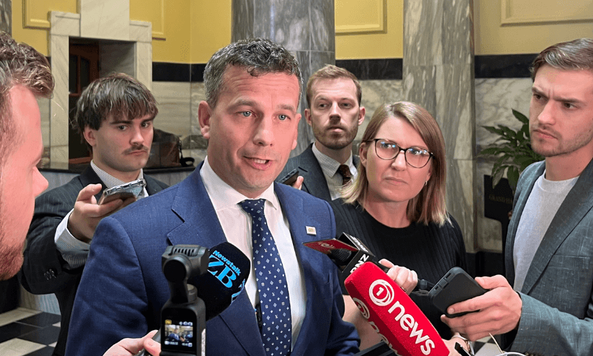 David Seymour speaking to reporters in parliament building.
