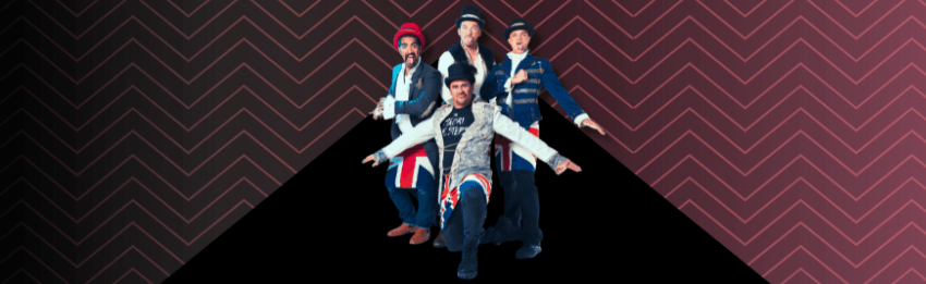 A group photo of musicians and performers standing on a graphic of a triangle. 