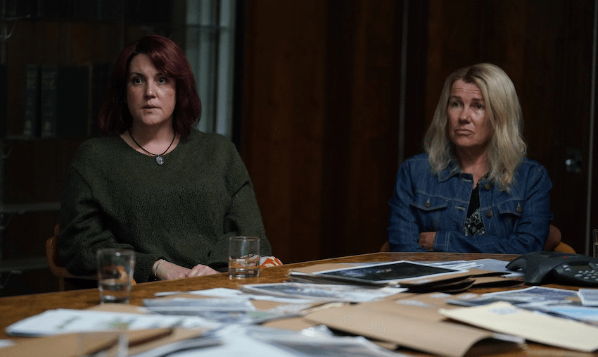 Anna Osborne and Sonya Rockhouse at a table strewn with papers