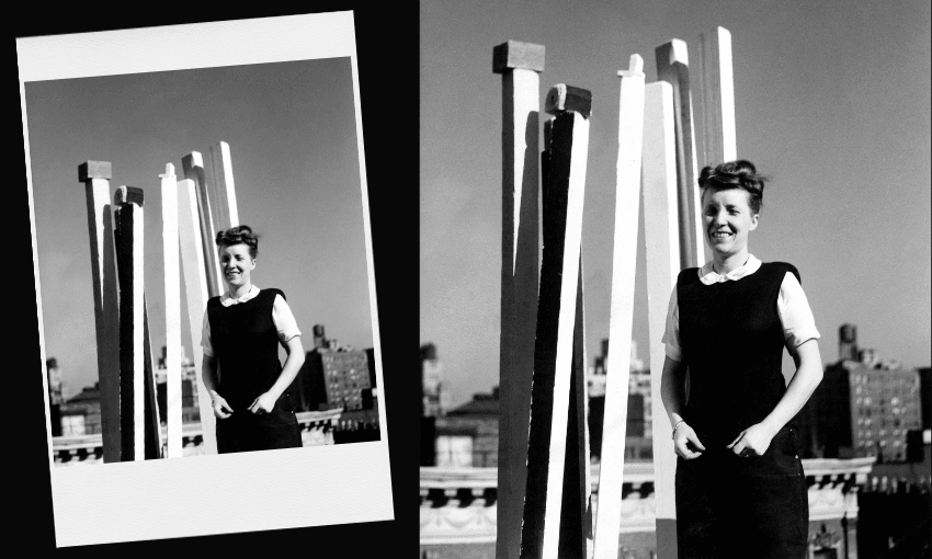 A woman in a dark dress and white blouse stands smiling in front of tall, vertical white sculptures on a rooftop, with city buildings visible in the background. An angled version of the same photo appears on the left.