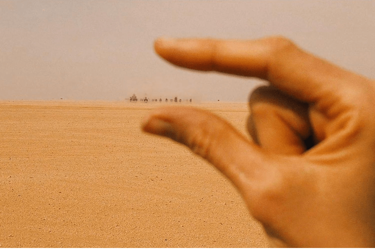 A hand judges the scale of an exodus.