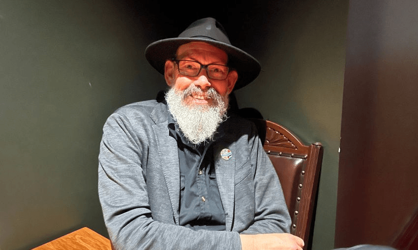 Steve Abel smiles at the camera while wearing his iconic wide brimmed hat.