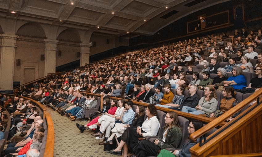 A wide shot of the seats in The Embassy theatre, showing mostly filled rows and many punters.