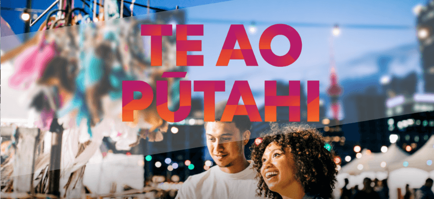A banner with a photo of a night market with the words 'Te Ao Pūtahi' overlaid.