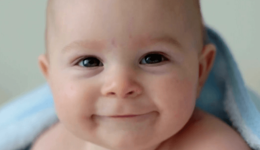 A close up of a smiling baby