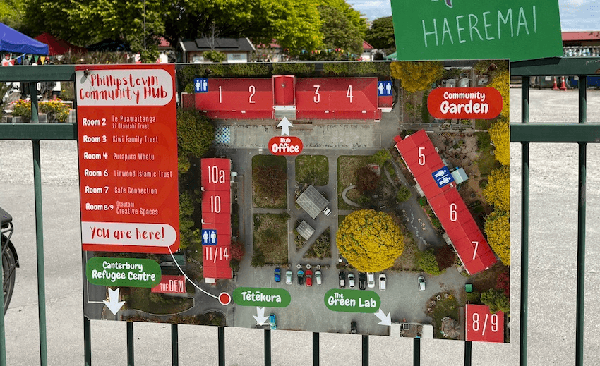 An aerial view map of The Hub attached to a fence with the words "haere mai"