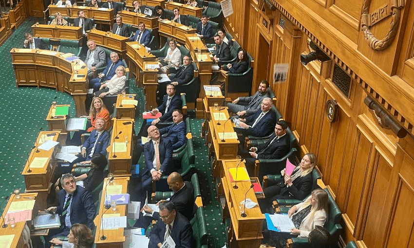 Ministers and MPs sitting on the government side of the House look up as pro-Palestine leaflets fall into the debating chamber.