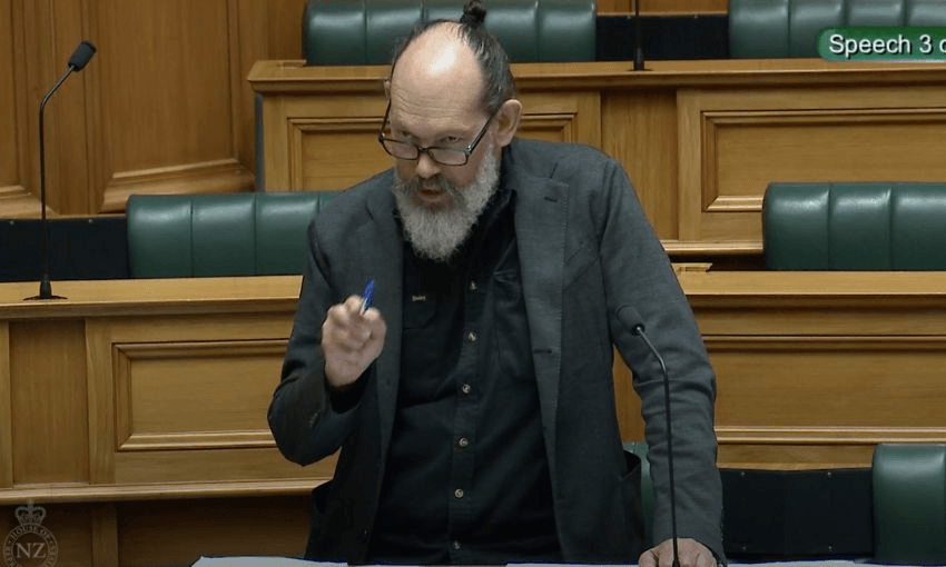 Steve Abel stands and speaks from his bench in the debating chamber.