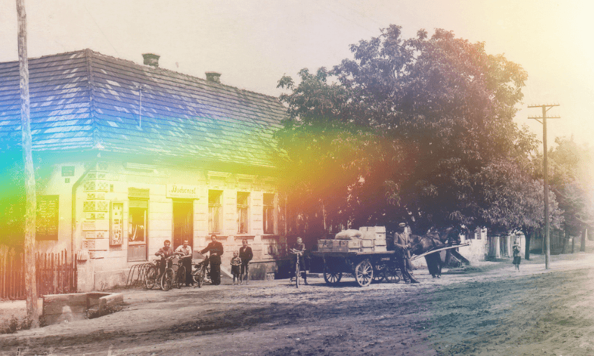 A black and white / sepia image of an old building with tree outside with a rainbow light effect overlaid.