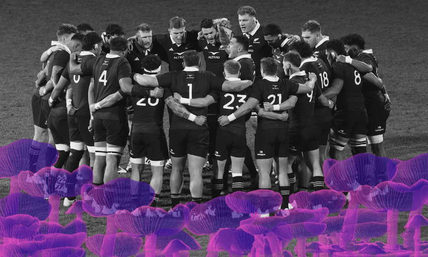 A rugby team in dark uniforms huddles together on a field, while the foreground features an overlay of translucent purple mushrooms. The image is in black and white except for the mushrooms.