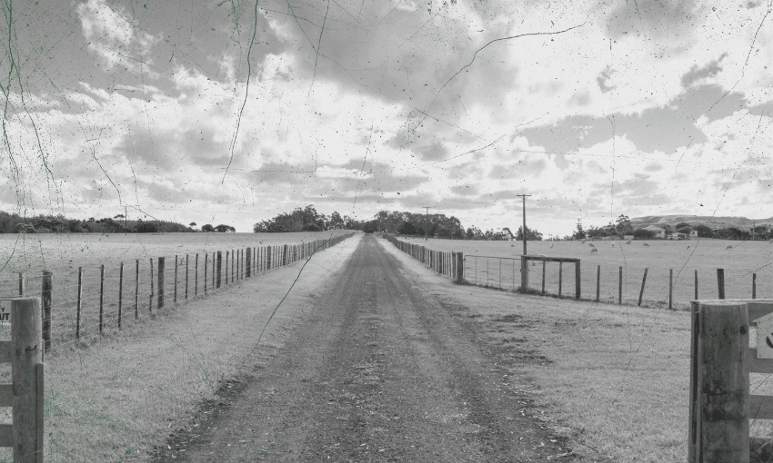 A long dirt road stretches straight ahead between fenced grassy fields under a cloudy sky, creating a sense of depth and distance; the image has a vintage, scratched texture.