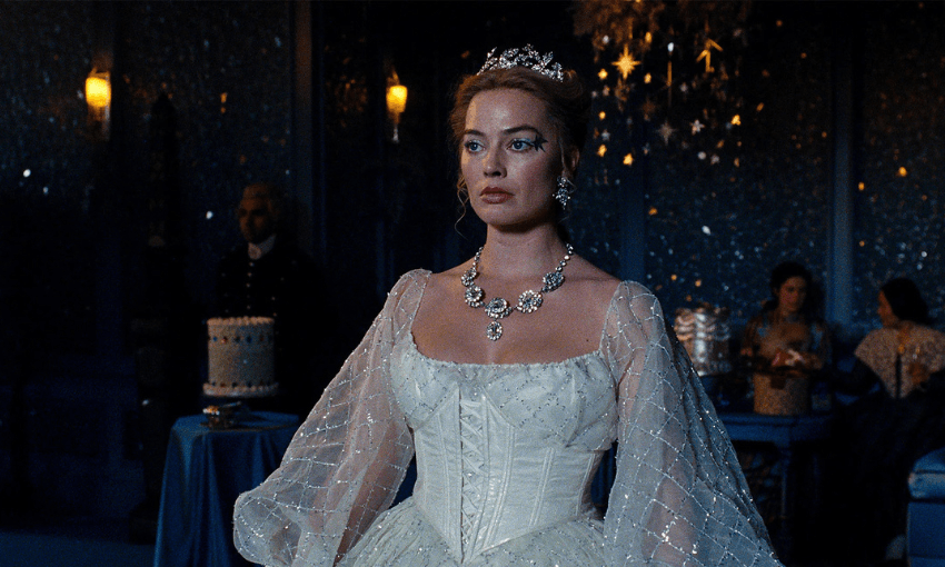 Margot Robbie in Wuthering Heights wearing an elaborate white dress and tiara.