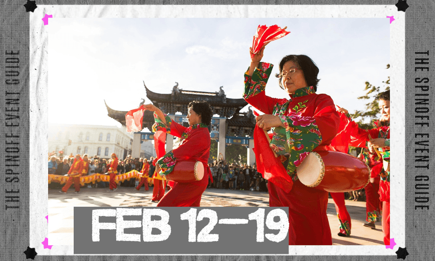 Two Chinese woman are dancing outside with a traditional Chinese building in the background.