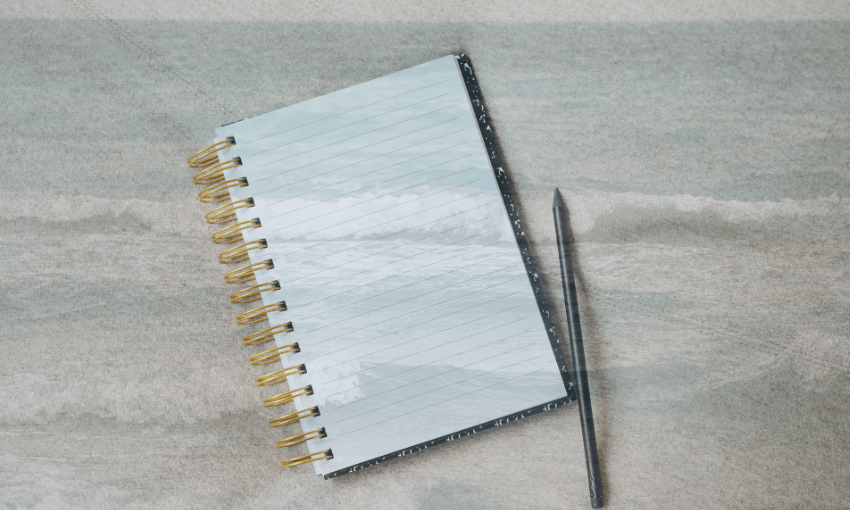 A photo of a spiral bound notebook and pen with a transparent image of waves overlaid.