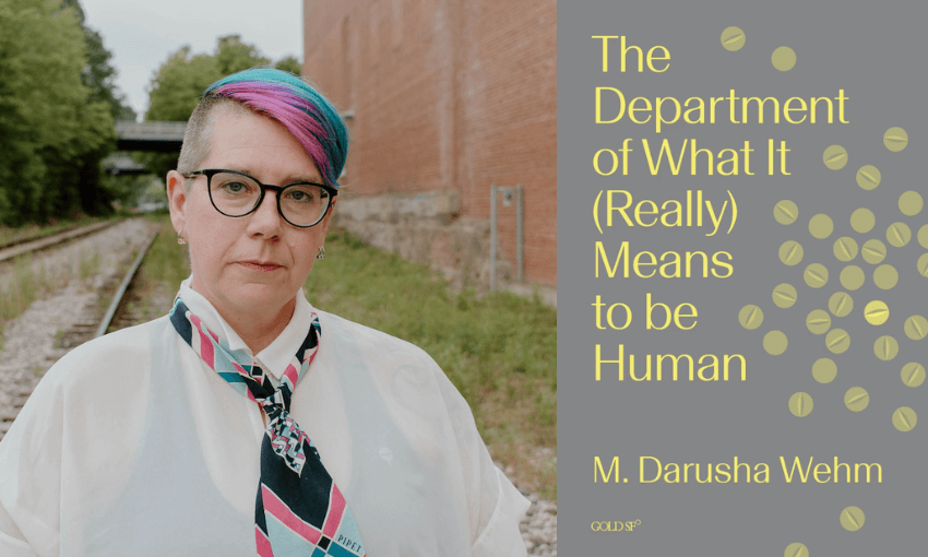 A photo of author Darusha Wehm who has short colourful hair, glasses and is wearing a shirt and scarf-tie. Beside her is the cover of her book which is grey with yellow lettering filling the space.