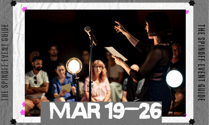 A photo of a woman performing, and holding a piece of paper, in front of a captivated audience.