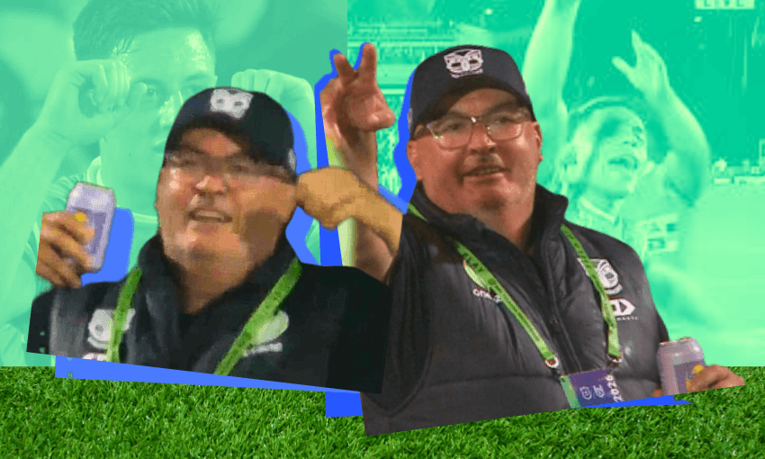 Two men in dark vests, hats, and glasses celebrate at a sporting event, holding drinks and making hand gestures, with cheering fans and a bright green and blue backdrop behind them.