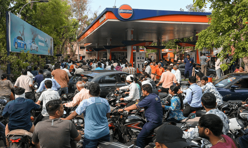 Queues for fuel in Ahmedabad, India. (Photo by Shammi MEHRA / AFP via Getty Images) 
