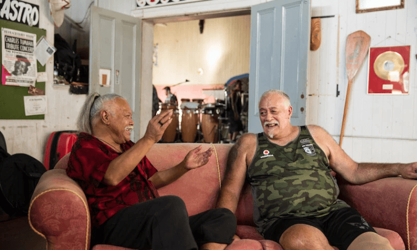 Old friends Willie Hona (left) and Dilworth Karaka catch up at Whare Tāpere, Herbs’ long time Kingsland practice space and HQ. (Image: Supplied). 

