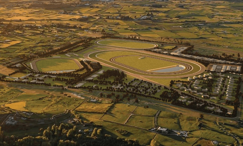 Aerial view of a large horse racing track complex surrounded by green fields, trees, and various buildings, with a road leading to the entrance and countryside in the background.