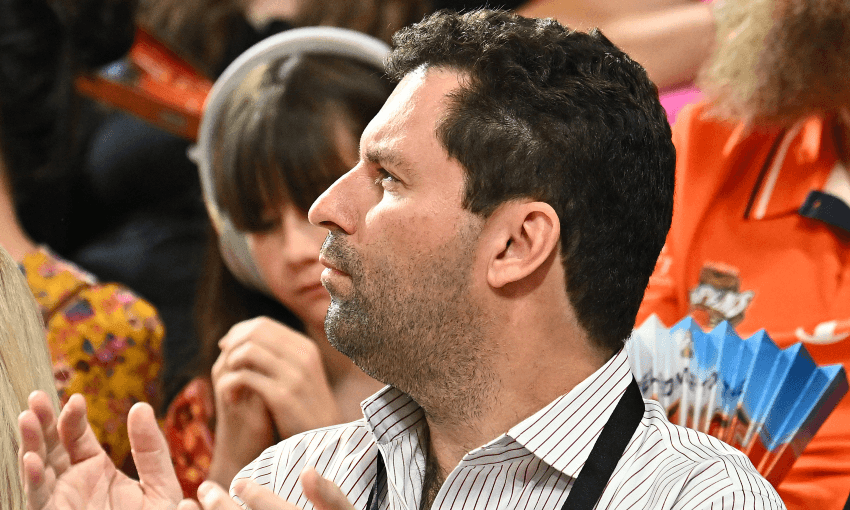 Jared Novelly cheers on his Illawarra Hawks, in an away game against the Cairns Taipans (Photo: Emily Barker/Getty Images) 
