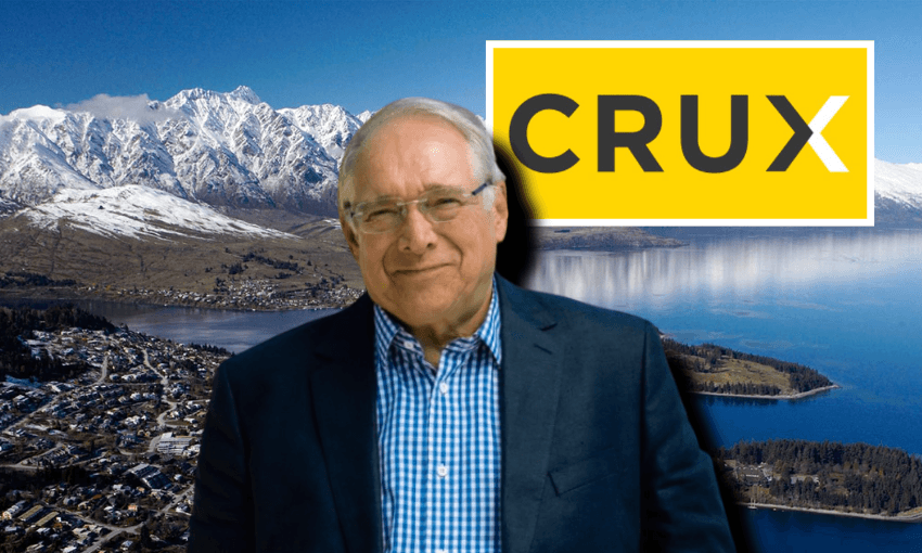 An older man in glasses and a blue blazer smiles in front of a mountain lake landscape. The word "CRUX" appears in bold letters on a yellow background in the top right corner.