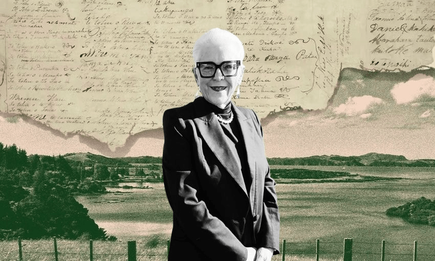 An older woman with short white hair, glasses, and a dark suit smiles while standing in front of a green landscape. Behind her, a historic handwritten document fills the sky.