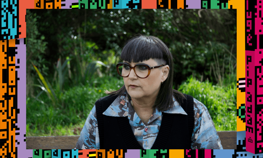 A photo of the writer pip adm who has short dark hair and glasses. She's seated outside and is look off to her right.