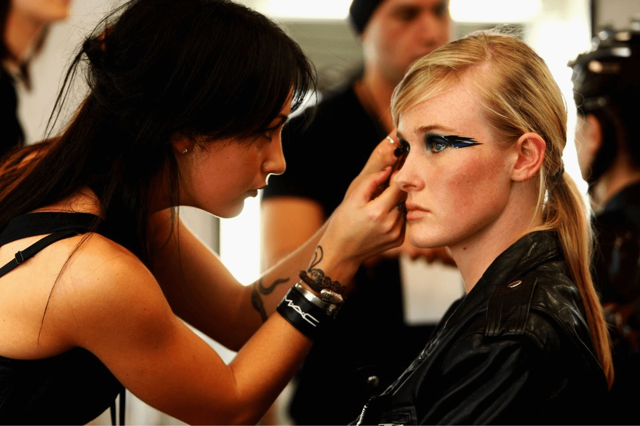 Makeup artist Kiekie Stanners works backstage at New Zealand Fashion Week