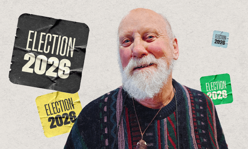 An older man with a white beard smiles in front of “Election 2026” signs in various colors on a textured background.