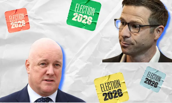 Two men in suits are shown on a crumpled white background, surrounded by colorful stickers reading “ELECTION 2026” in green, red, yellow, and blue.