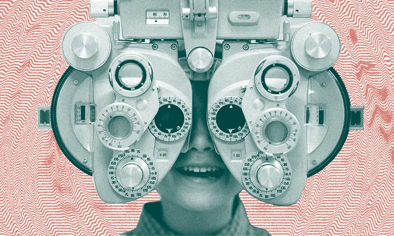 a kid getting their eyes tested