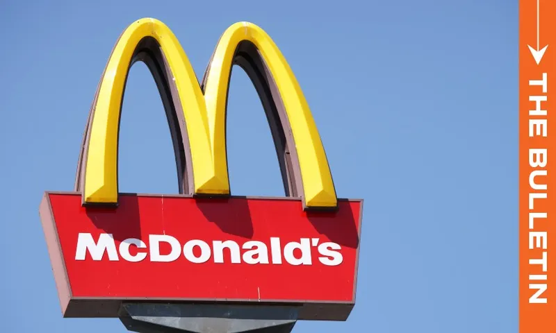 The McDonald's golden arches logo on the left side against a sky blue background