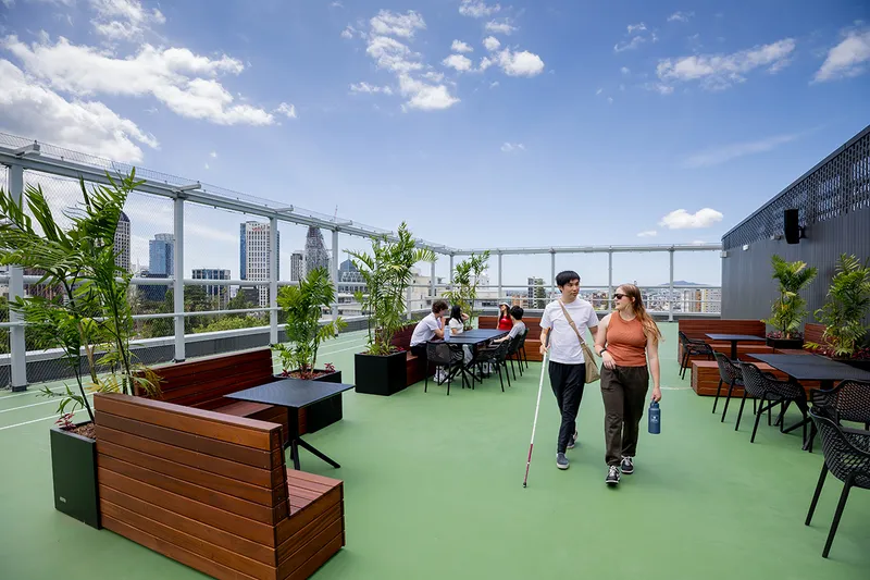 roof top in central auckland with view, and people walking around