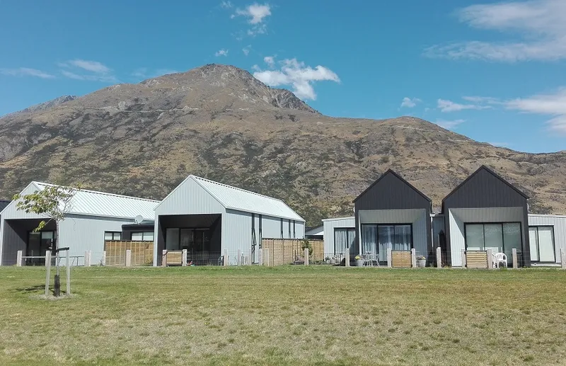 photo of stand-along homes with mountain in the background