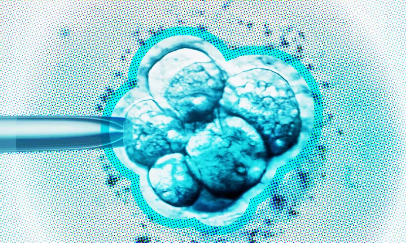 A digitally edited image shows a cluster of rounded cells in shades of blue, resembling an embryo under a microscope. A pipette-like object approaches from the left, suggesting a scientific or medical procedure. Bright, high-contrast lighting accentuates the texture.